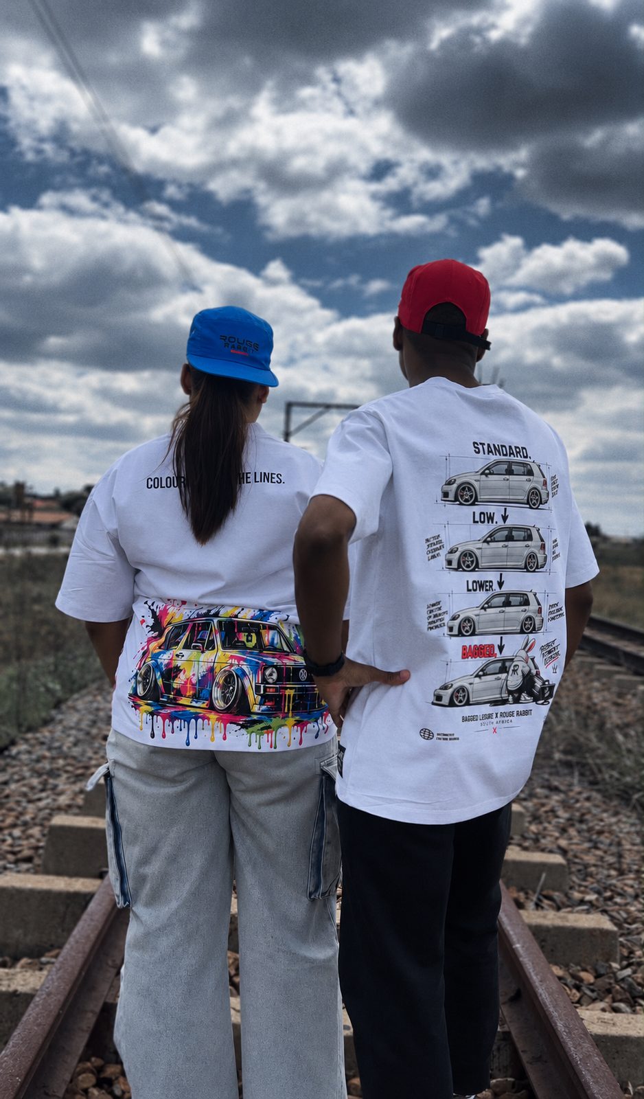 Paint Shop tee back print — Colour outside the lines — worn on the railway tracks